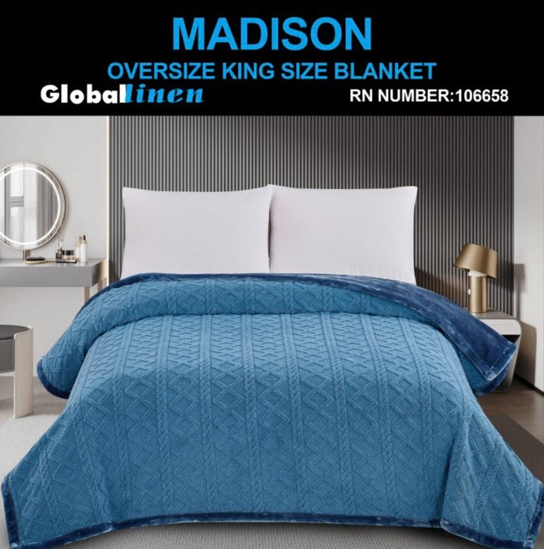 Blue oversized king size blanket on a bed with 'Madison' and 'Global Linen' branding.