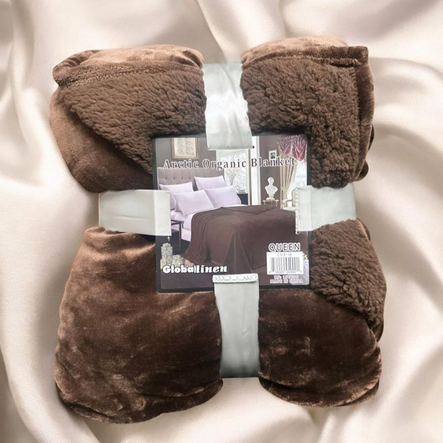 Brown blanket with packaging on a white fabric background