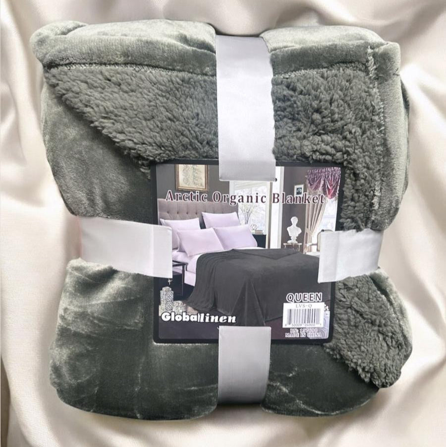 Gray blanket with Globalinen packaging on a white background