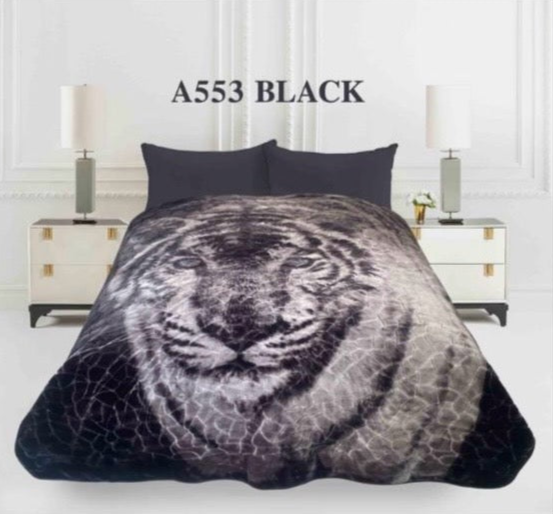 Black and gray tiger patterned blanket on a bed with 'A553 BLACK' text above.